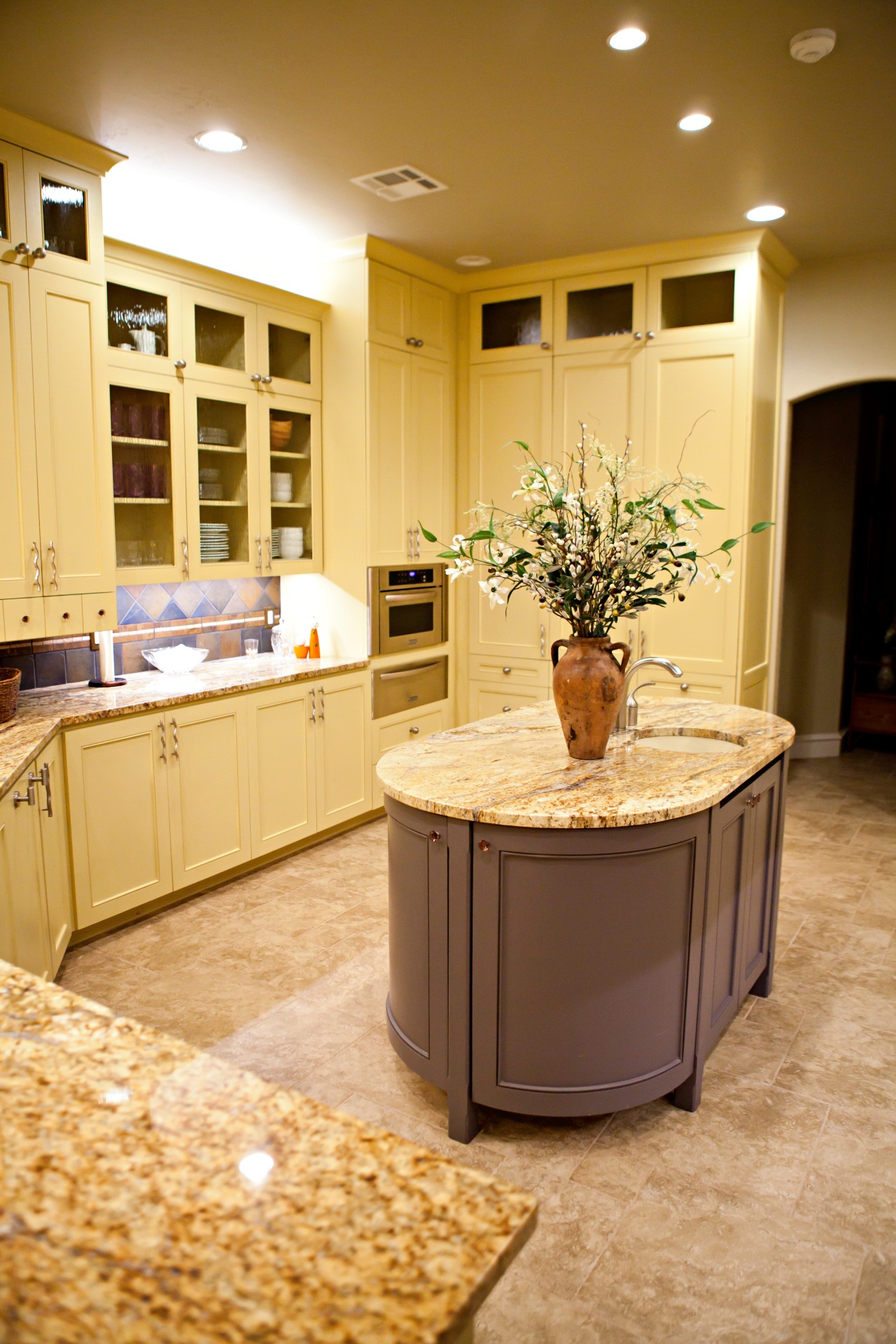kitchen with oval countertop in the middle