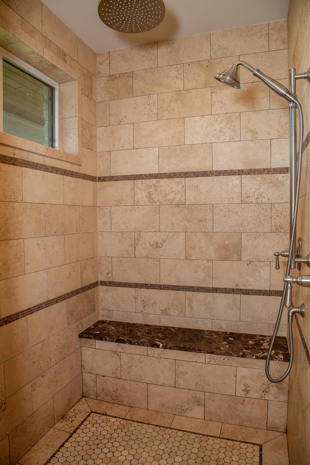 shower area with brown tiles