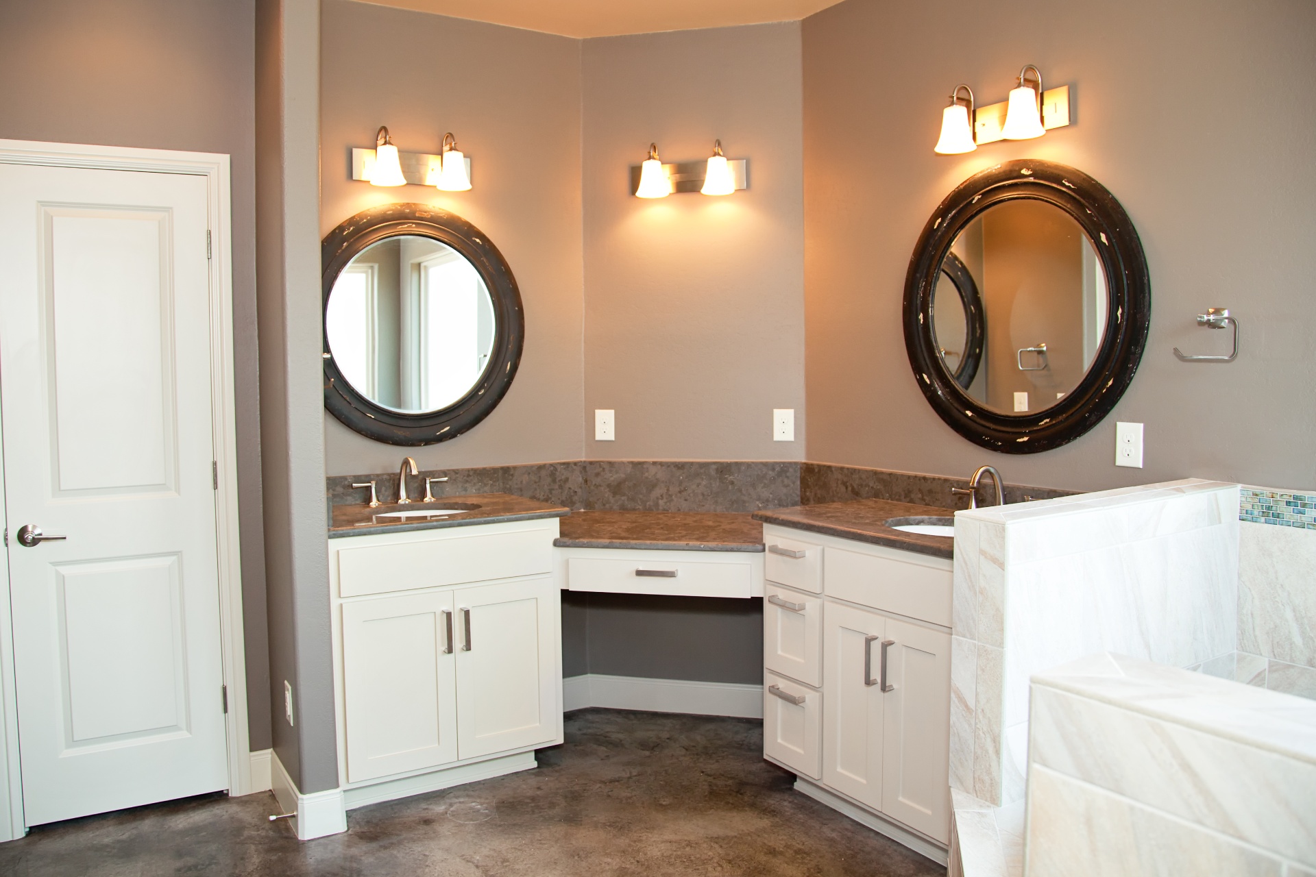 minimalist bathroom with round mirrors